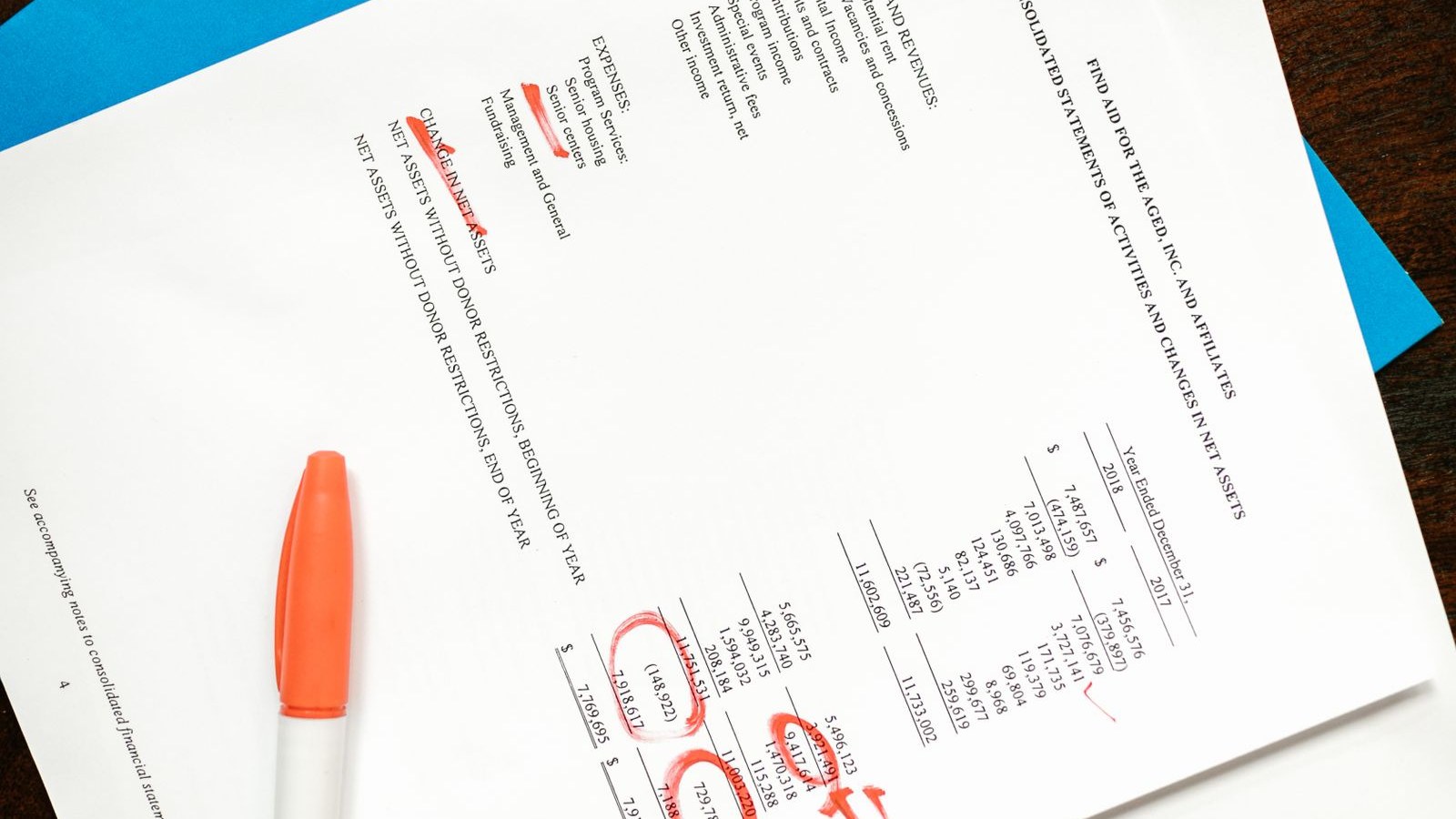 A benefits policy printout on a break room table with one paragraph underlined